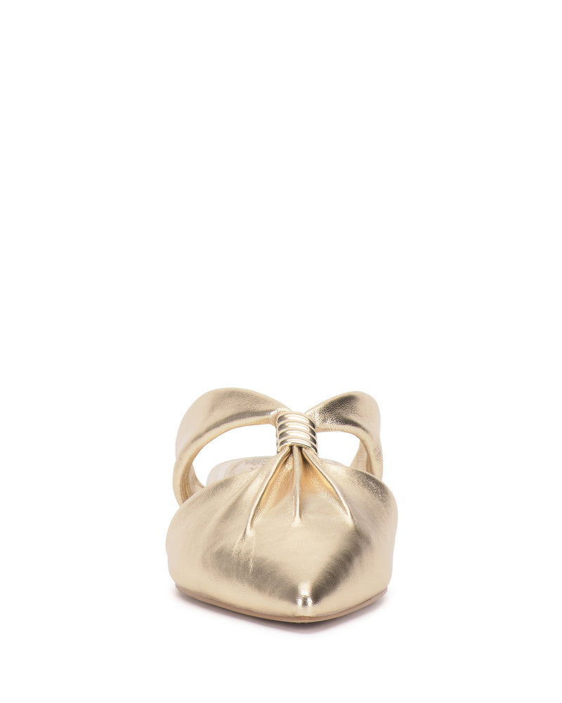 Front view of the Vince Camuto Vanika Mule, featuring a gold, pointed toe, twisted gathered upper detail, and an open back.