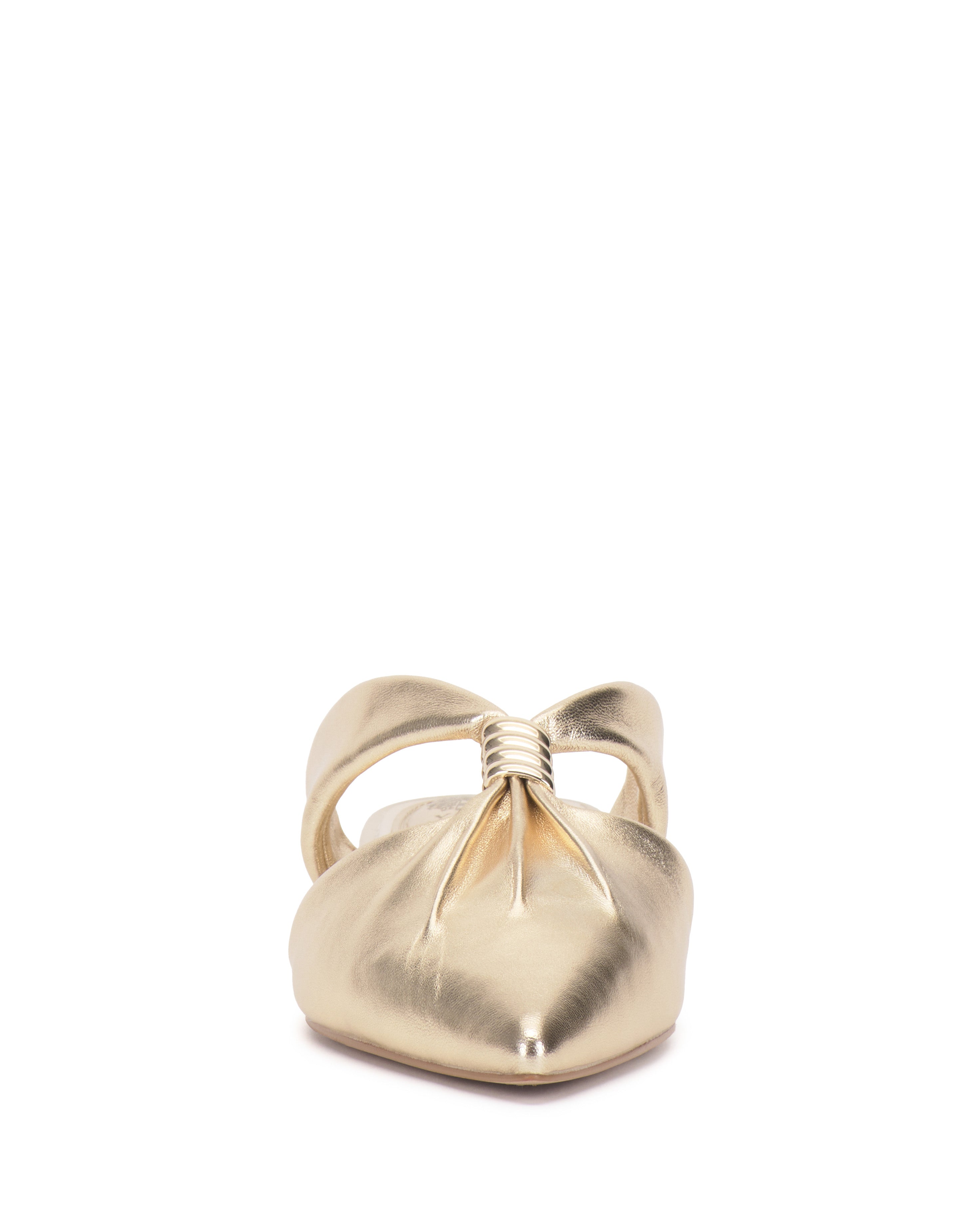 Front view of the Vince Camuto Vanika Mule, a shiny gold women’s slip-on with a pointed toe, low block heel, and a gathered knot detail on the upper.