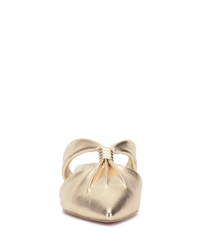 Front view of the Vince Camuto Vanika Mule, a shiny gold women’s slip-on with a pointed toe, low block heel, and a gathered knot detail on the upper.