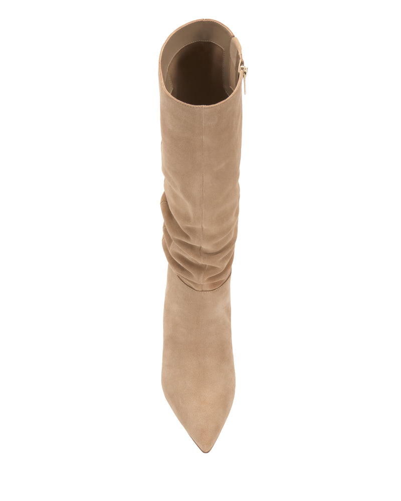 Vince Camuto Vanisa Narrow Calf Knee High Boot in tan suede, featuring a pointed toe and a slouchy shaft, shown from an overhead view against a white background.