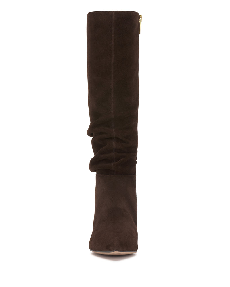 Front view of the Vince Camuto Vanisa Wide Calf Knee High Boot, featuring a tall, dark brown suede construction with a slightly slouched shaft and rounded toe, set against a white background.