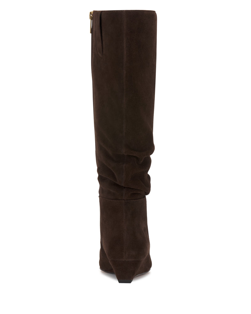 The Vanisa Wide Calf Knee High Boot by Vince Camuto is shown from the back in tall, dark brown suede, featuring a slightly slouched shaft and a zipper on the left side.