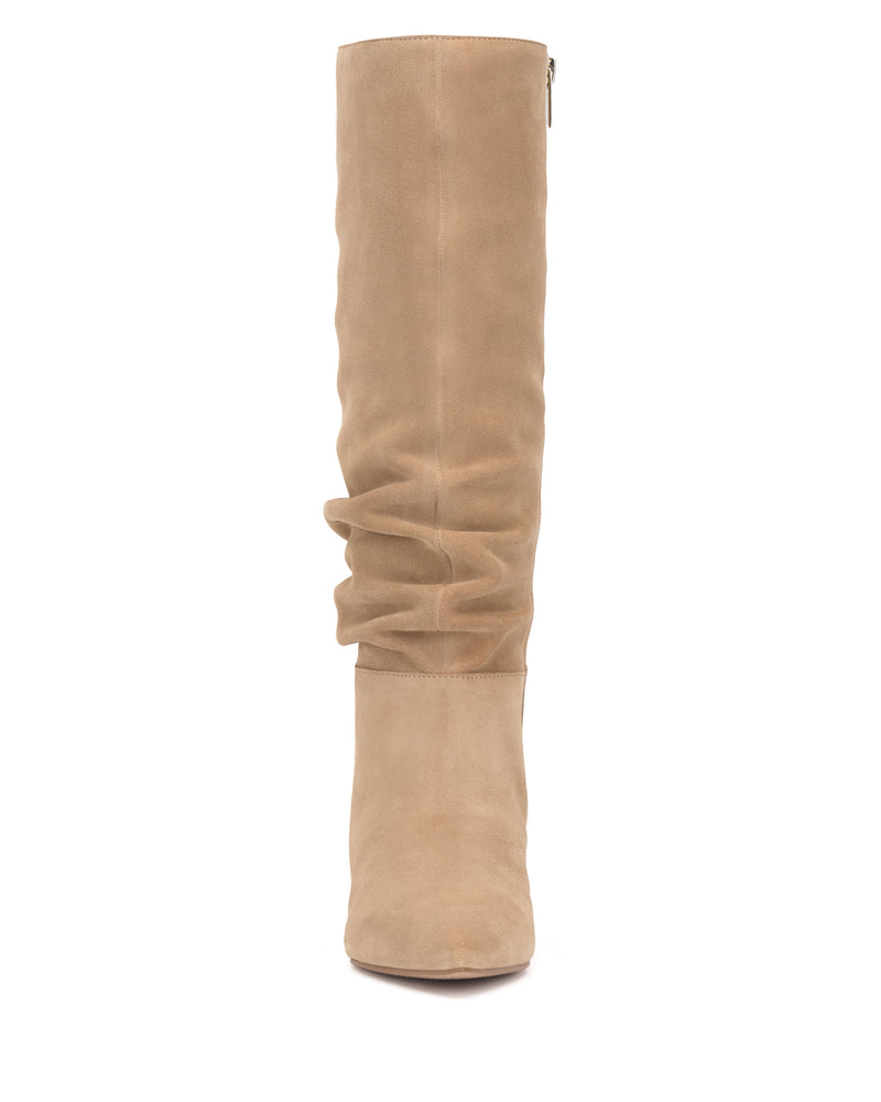 Front view of the Vanisa Extra Wide Calf Knee High Boot by Vince Camuto—a tall, tan suede boot with a smooth texture, slightly slouchy midsection, closed rounded toe, and a side zipper.