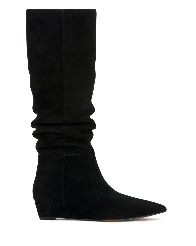 The Vanisa Knee High Boot by Vince Camuto, shown in a left side profile against a white background, features black suede in a slouch design with a pointed toe and a low wedge heel.