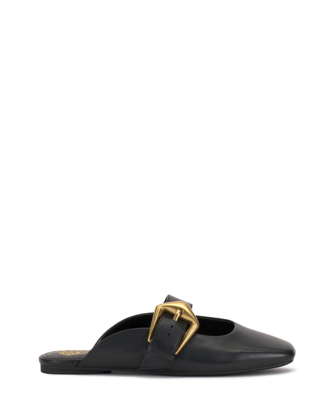The Vellma Buckle Mule by Vince Camuto is a black leather flat mule with a pointed toe and a bold gold buckle on the side, displayed in profile against a plain white background.