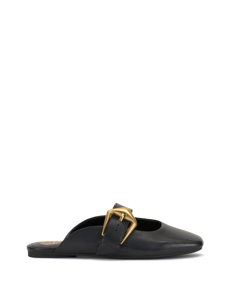 The Vellma Buckle Mule by Vince Camuto is a black leather flat mule with a pointed toe and a bold gold buckle on the side, displayed in profile against a plain white background.