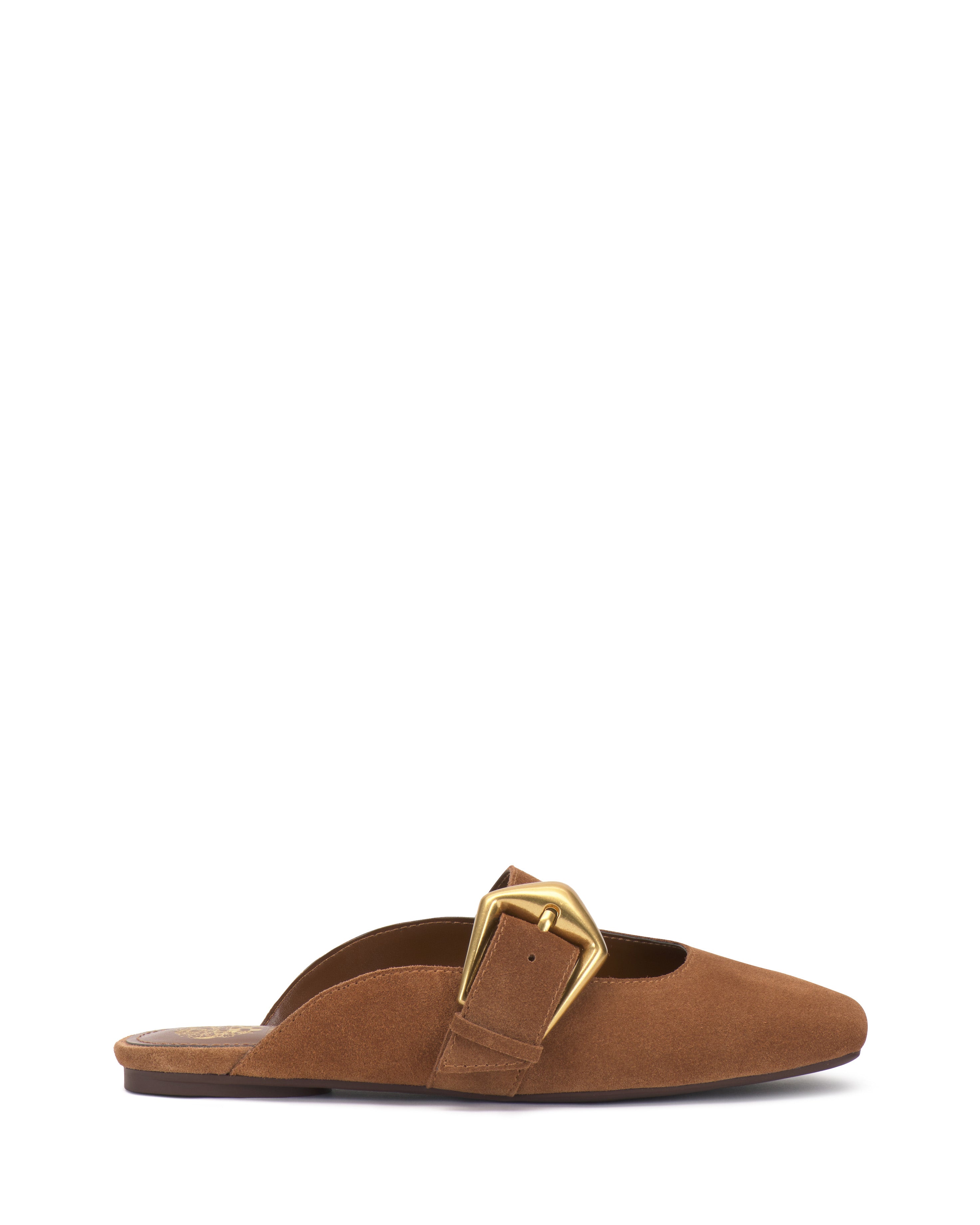 The Vince Camuto Vellma Buckle Mule is a brown suede backless shoe with a pointed toe and prominent gold buckle detail, displayed in profile against a white background.