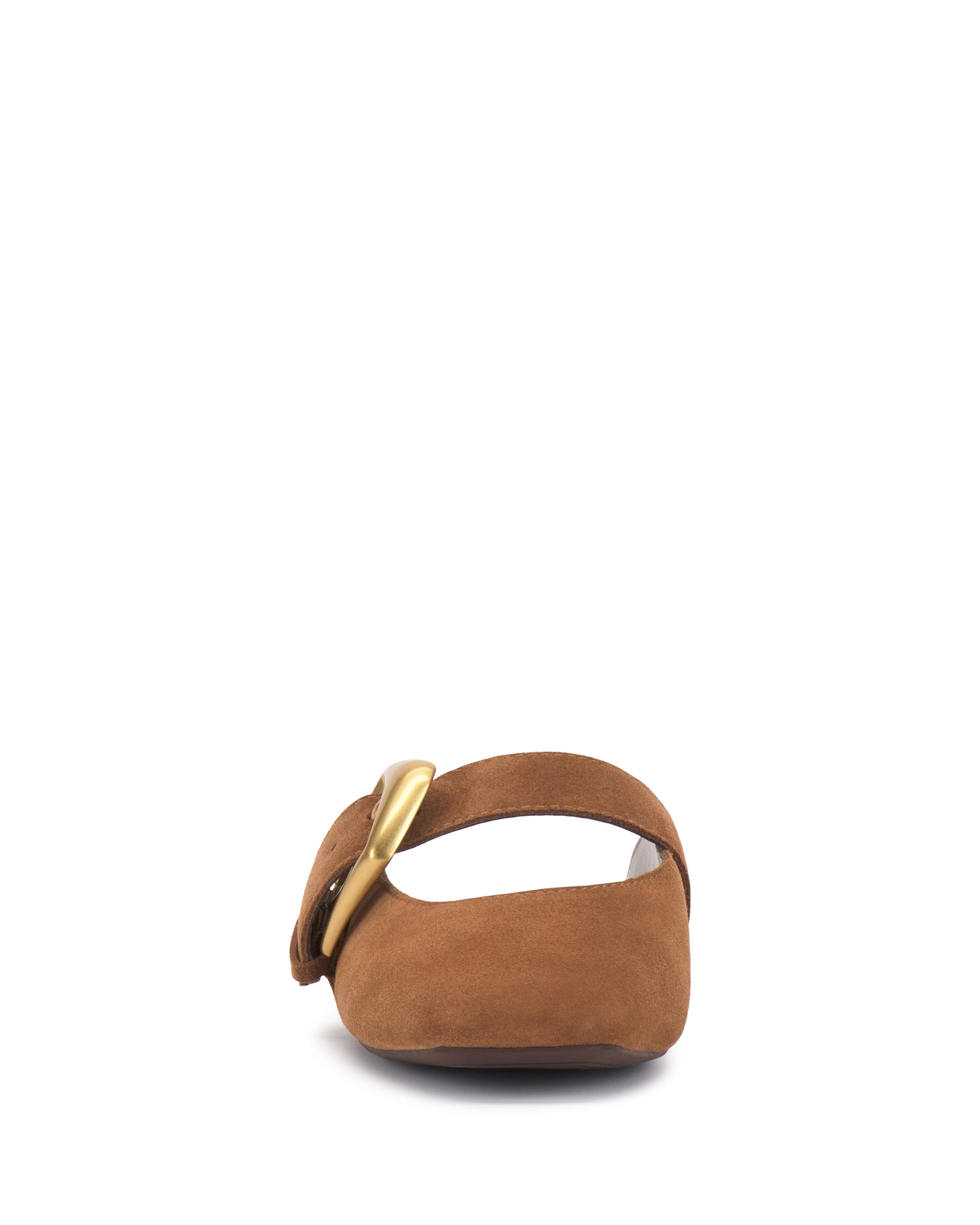 Front view of the Vellma Buckle Mule by Vince Camuto, a brown suede flat shoe with a wide strap and large gold buckle on the left side, set against a plain white background.