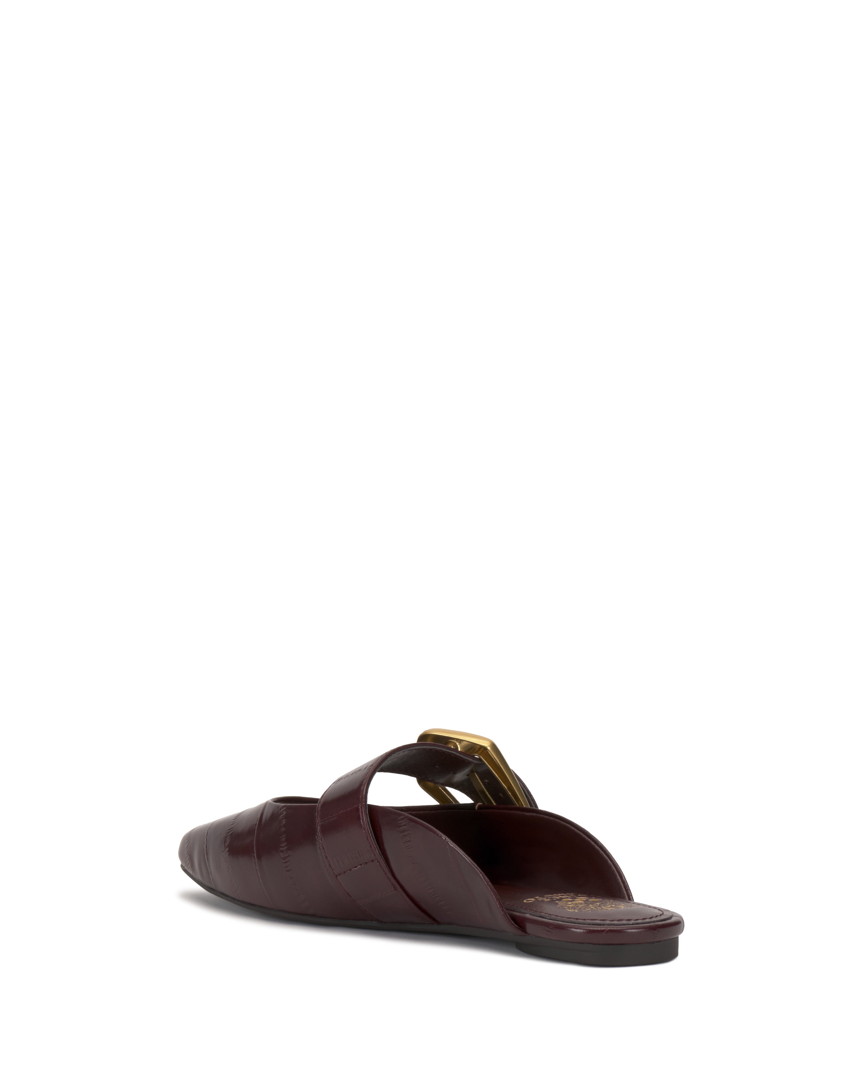 The Vellma Buckle Mule by Vince Camuto is a maroon low-heeled mule with crossed straps and a gold accent, shown from the back on a white background.