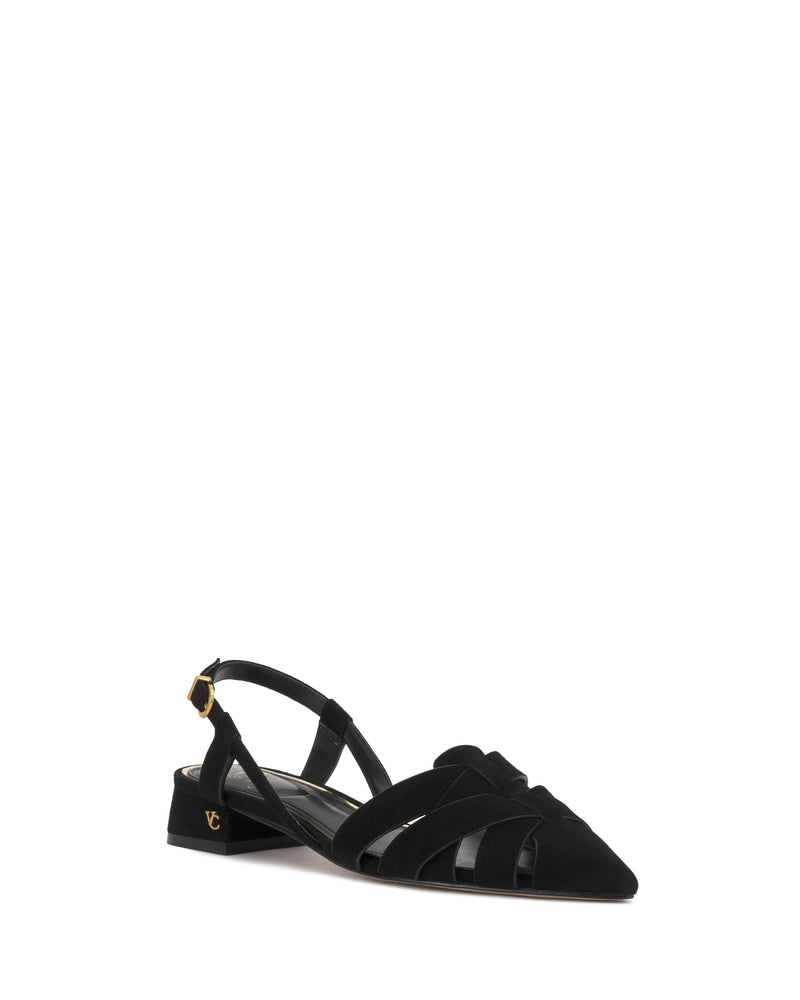 The Vinesha Sandal by Vince Camuto is a black pointed-toe flat with a low heel, side cut-out details, gold buckle strap, and a small gold logo on the outer heel.