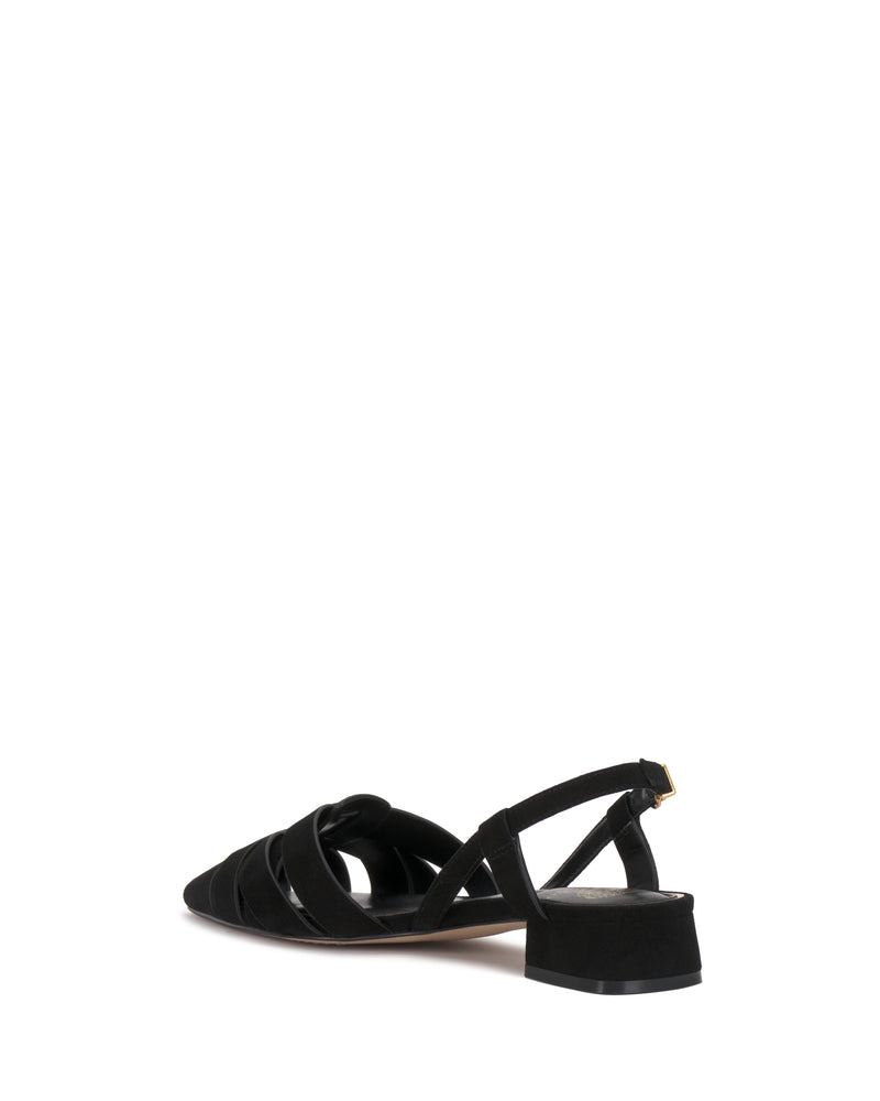 The Vinesha Sandal by Vince Camuto is a black, low-heeled slingback with a pointed toe and crisscross straps, shown from the back right angle on a white background.