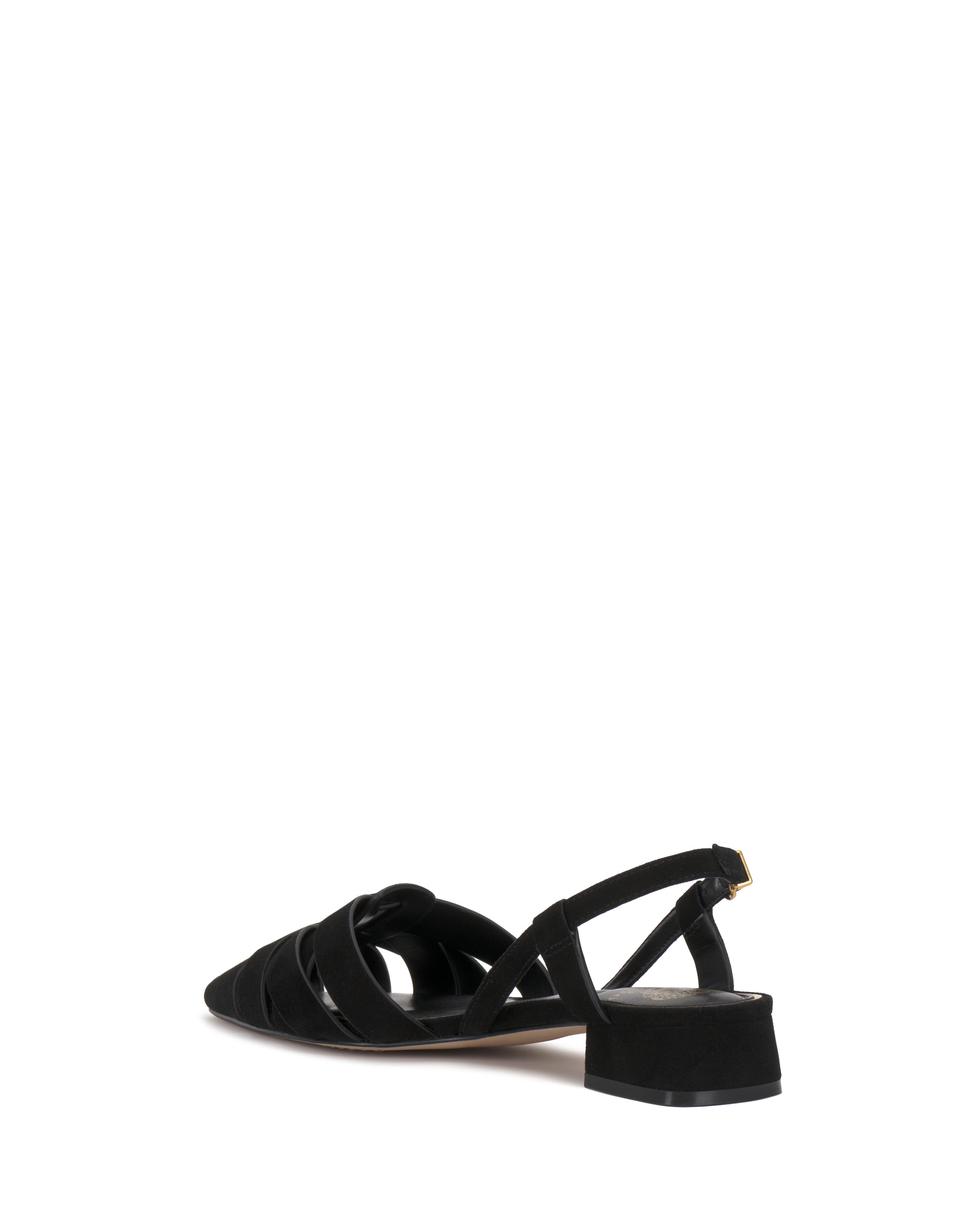 The Vince Camuto Vinesha Sandal in black features a chic woven design, pointed toe, crisscross straps, and low block heel, shown from a rear side angle on a white background.