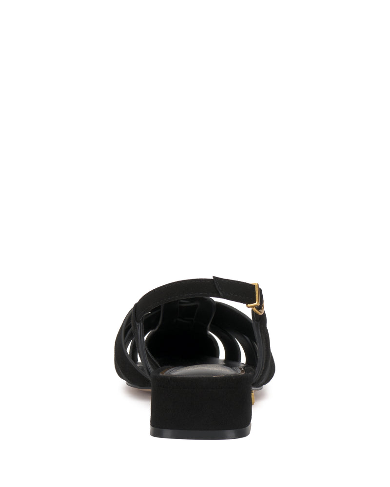 The Vinesha Sandal by Vince Camuto is shown from the back, featuring a flat sole, ankle strap with a small gold buckle, and open heel design against a white background.