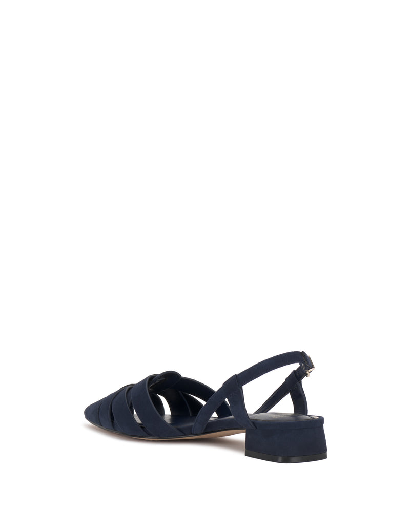 The Vinesha Sandal by Vince Camuto is a navy blue women's low-heeled sandal with a pointed toe, multiple front straps, and an ankle slingback strap, shown from a rear side angle on a white background.