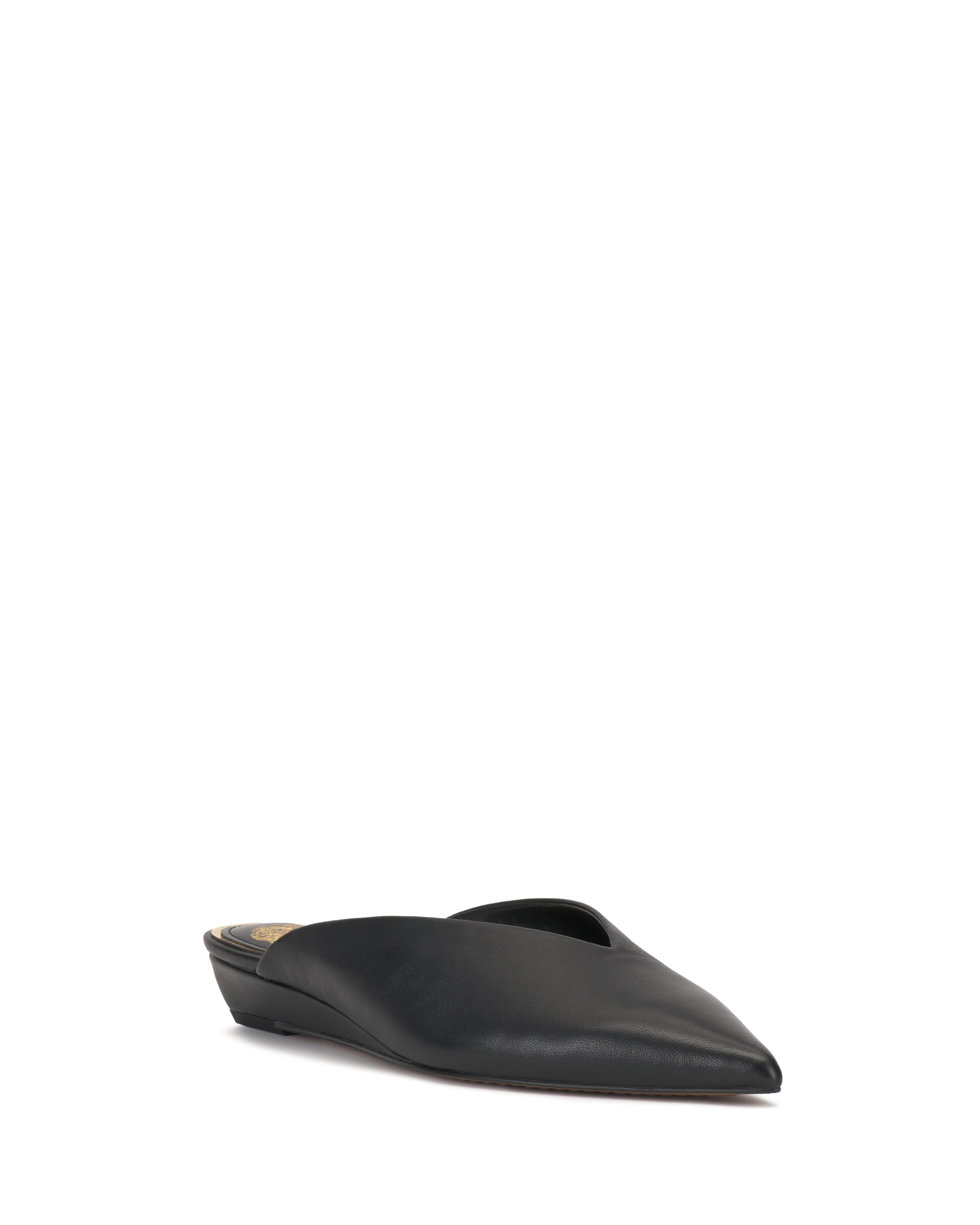 The Vinia Mule by Vince Camuto features a sleek black pointed toe, a backless flat design, and a low heel, shown against a plain white background.