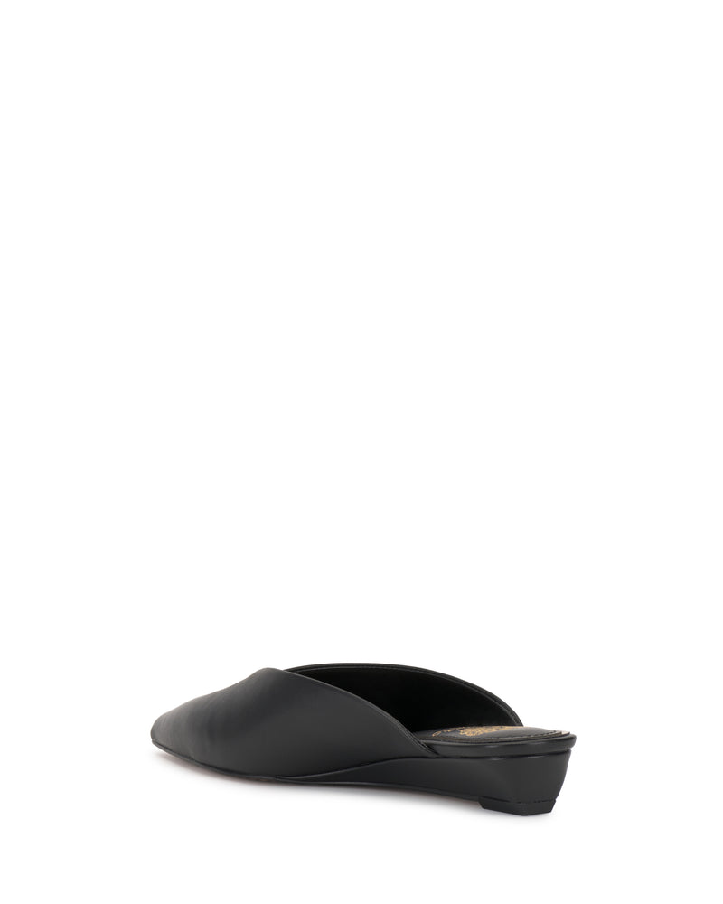 The Vinia Mule by Vince Camuto is a black slip-on shoe with a low block heel, displayed from the back and slightly to the side against a white background.