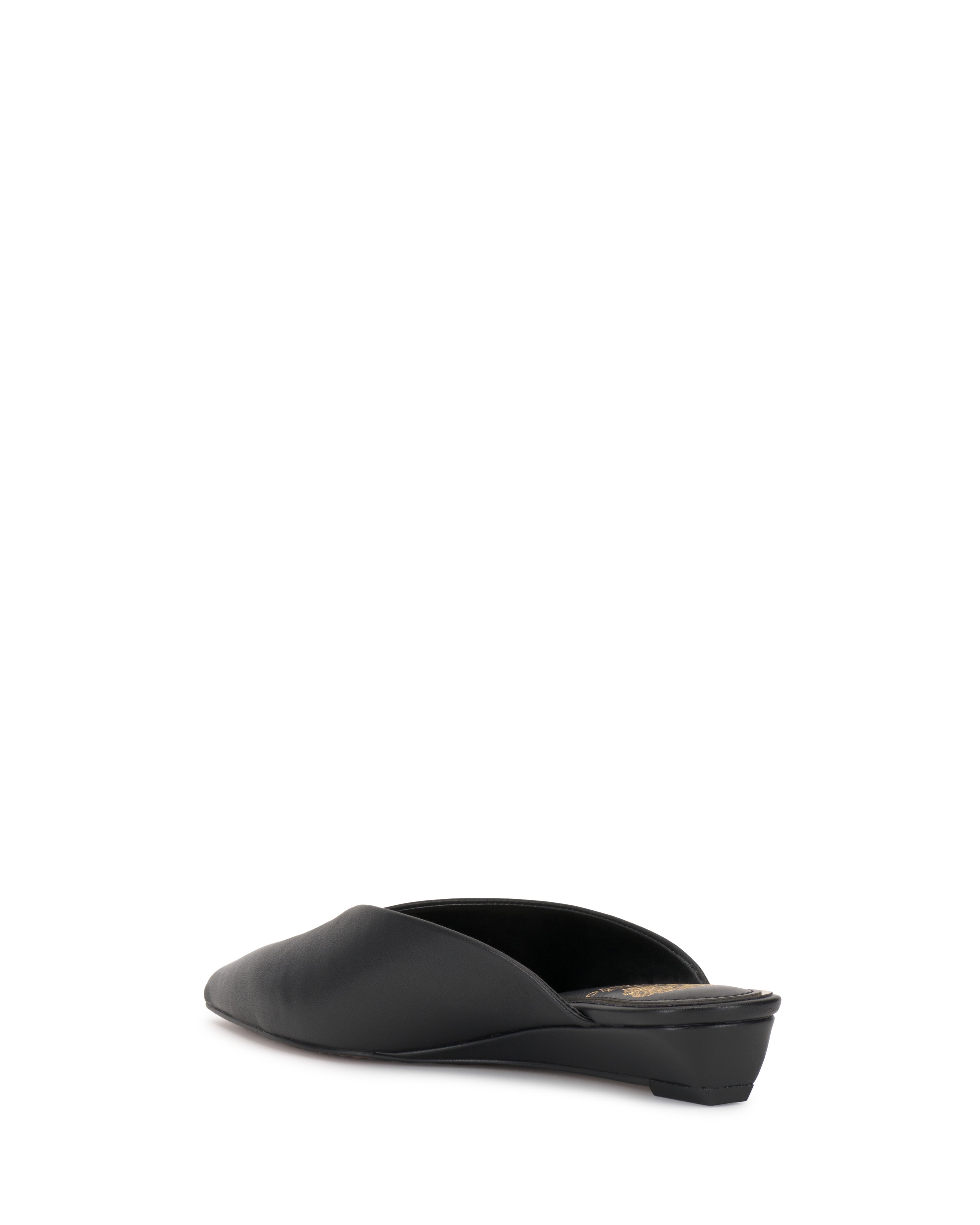 The Vinia Mule by Vince Camuto, in black with a low heel and pointed toe, is shown from the back at a slight left angle against a plain white background.