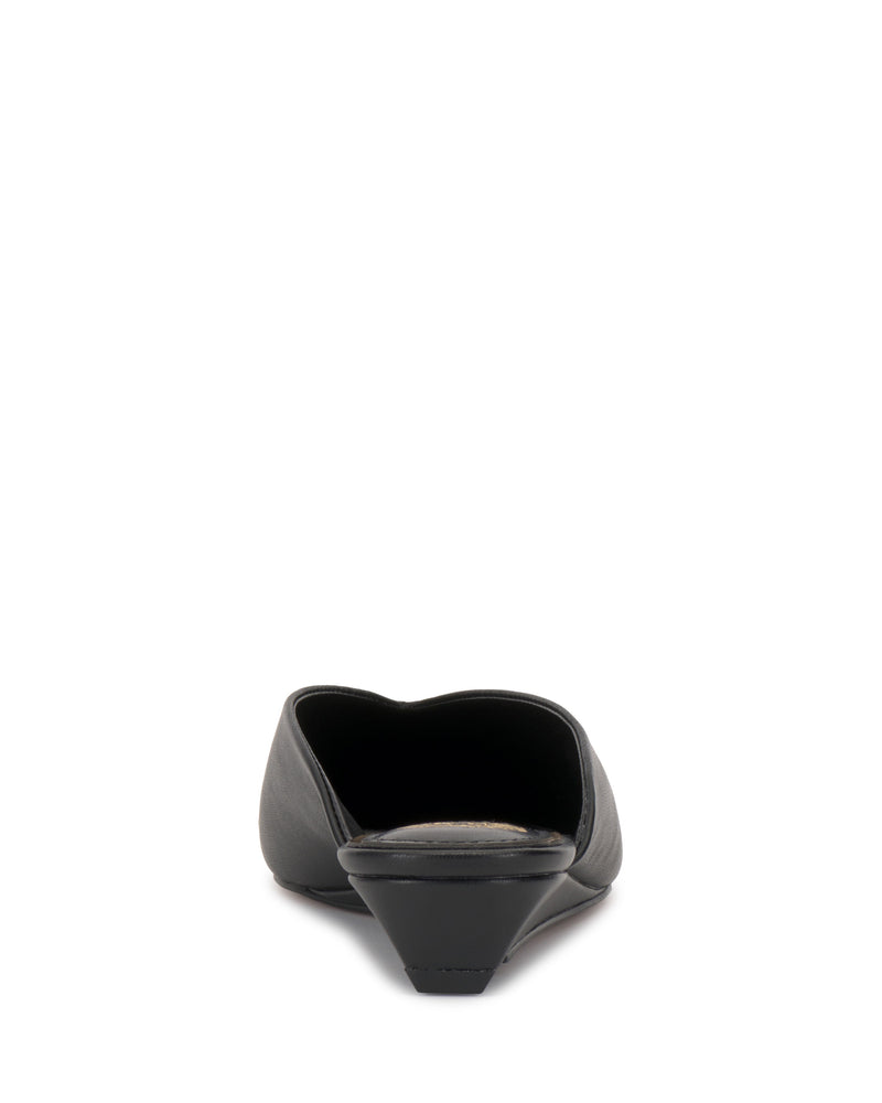 Back view of the Vinia Mule by Vince Camuto, a black slip-on with a low angled heel and backless flat design, shown against a white background.