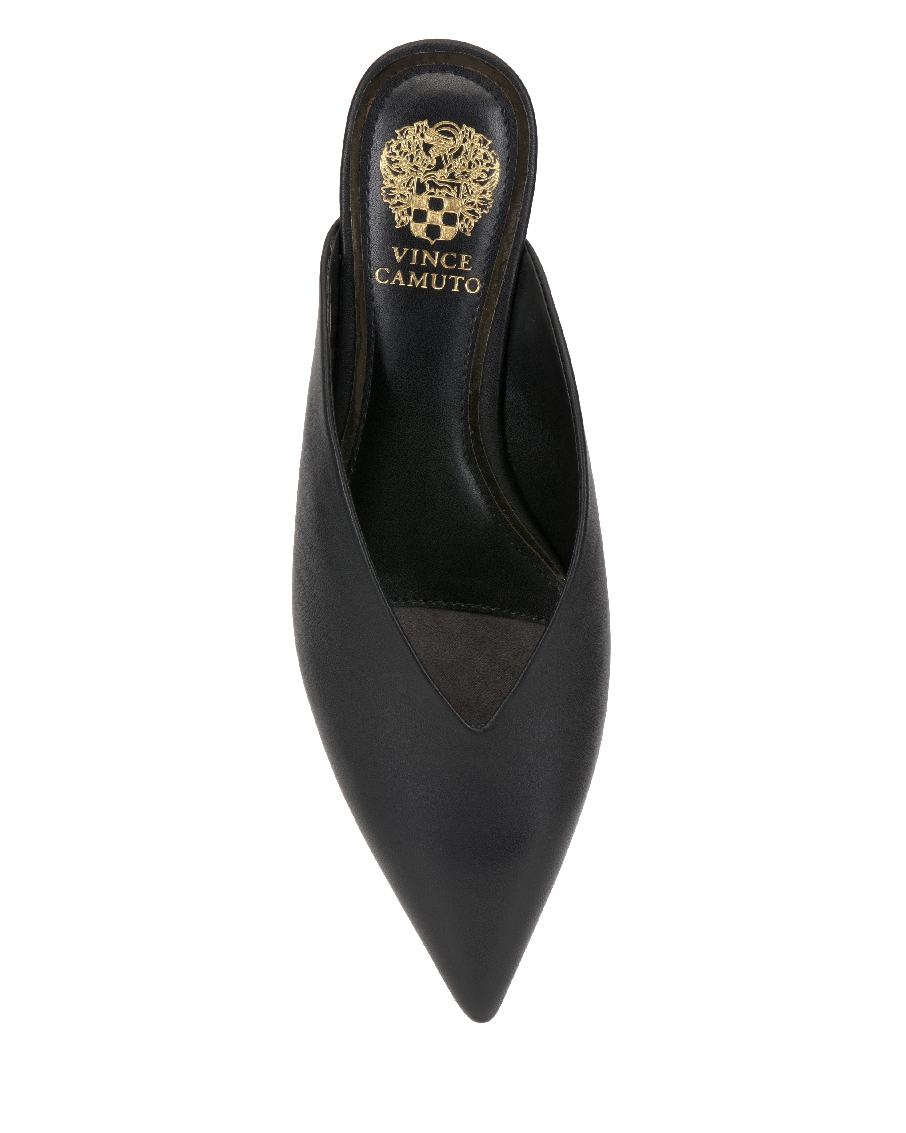 The Vinia Mule by Vince Camuto is a black, pointed-toe backless flat with a V-shaped opening and gold crest on the insole, showcased from above on a white background to emphasize its chic minimalist style.