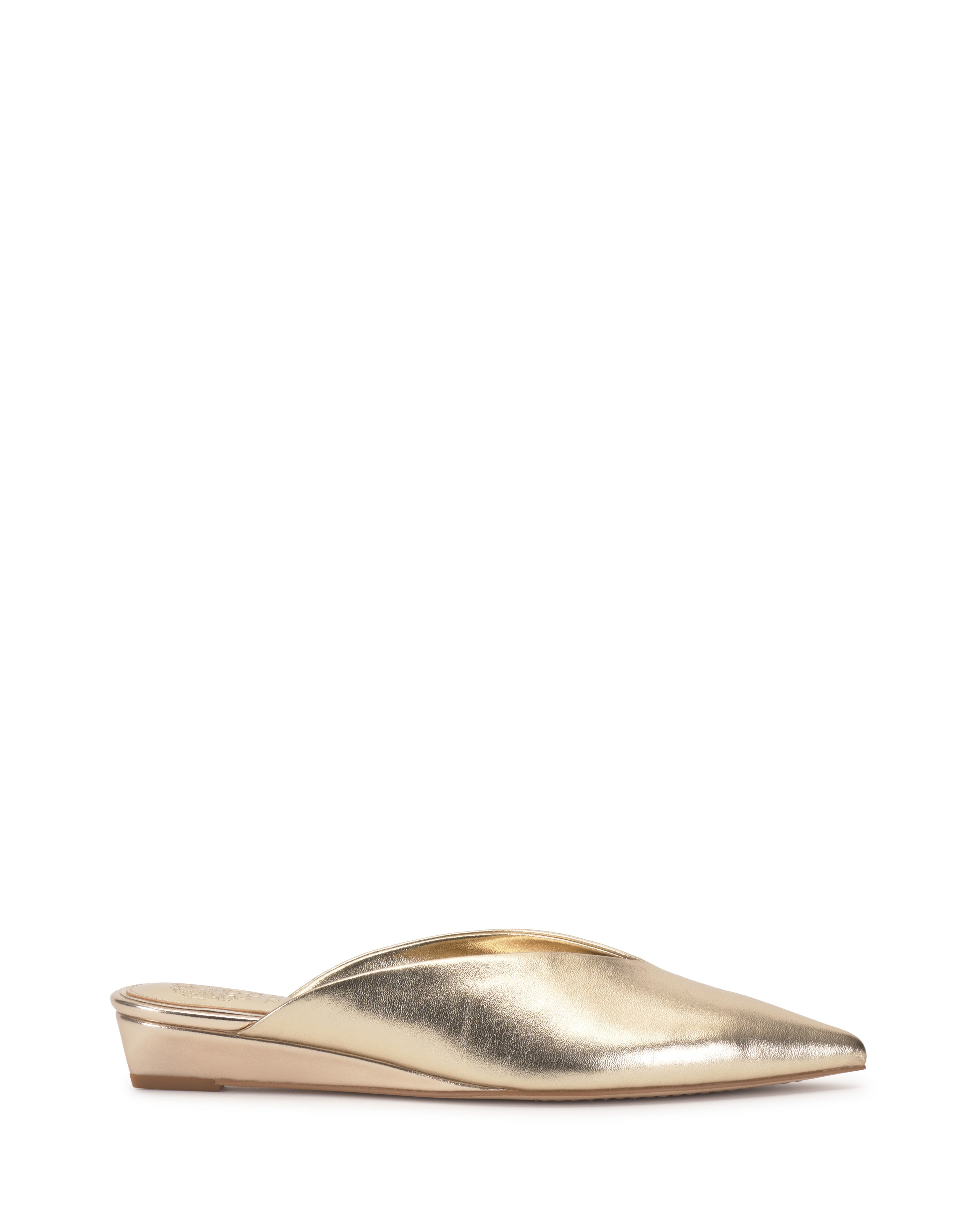 The Vinia Mule by Vince Camuto, a gold metallic pointed toe mule with a low wedge heel and minimalist design, is displayed on a plain white background.
