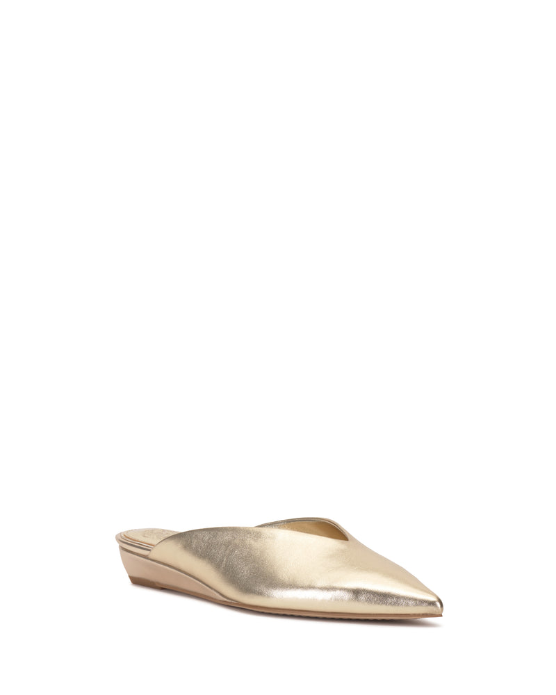 The Vinia Mule by Vince Camuto features a gold pointed toe, low wedge heel, slip-on design, and smooth metallic finish, shown on a white background.