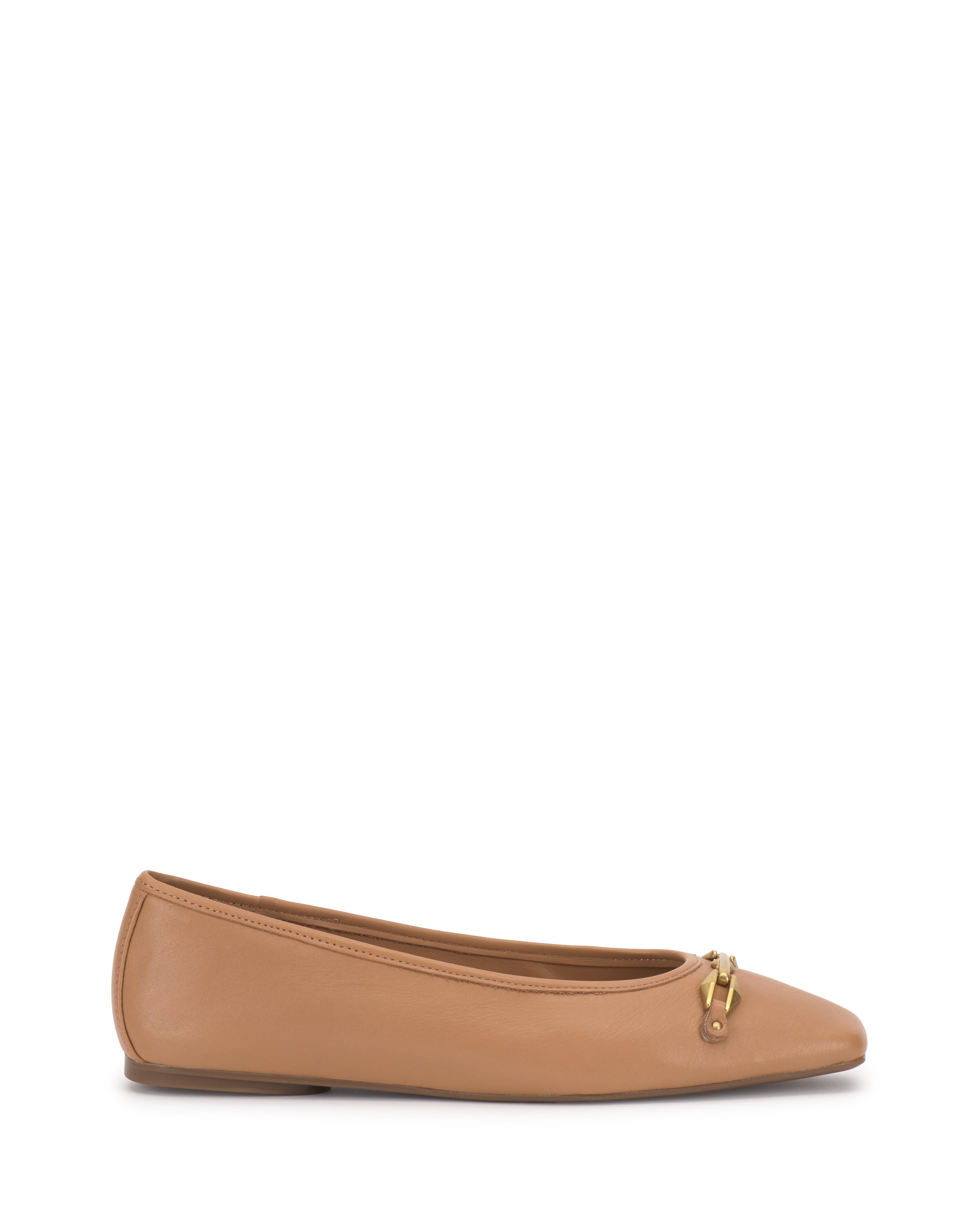 The Vince Camuto Virna Link Ballet Flat is a tan leather shoe with a rounded toe and a small gold buckle on the front, displayed in side profile against a white background.