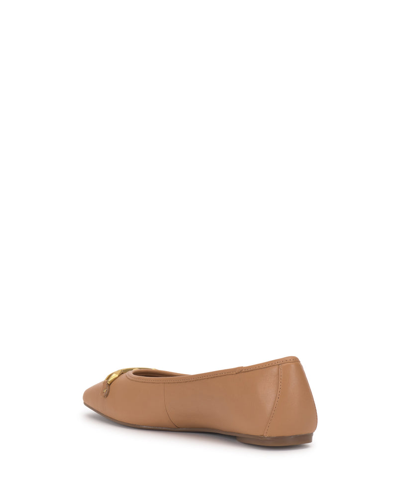 The Vince Camuto Virna Link Ballet Flat in tan leather features polished hardware and is shown from a rear side angle against a white background.