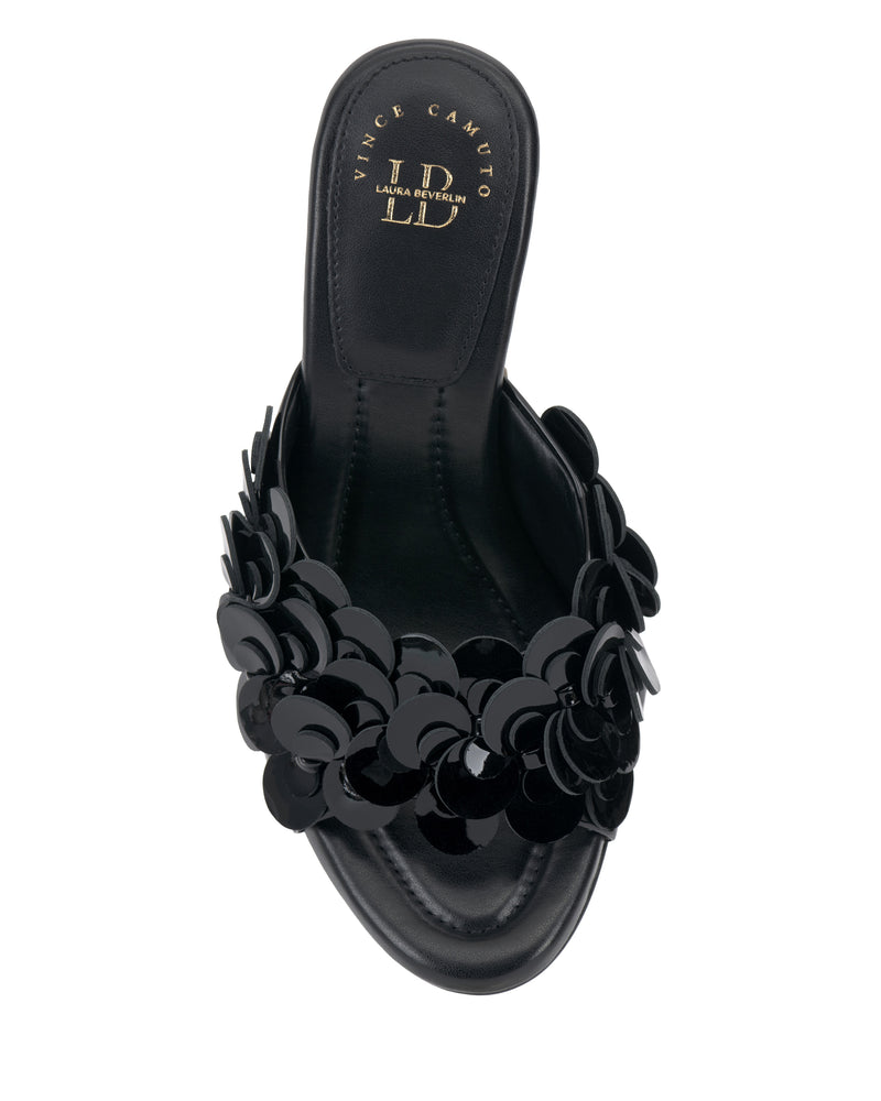A Vince Camuto Rose Mule in black featuring a wide strap with glossy floral appliqués, a padded footbed for comfort, and an open toe, shown from above.