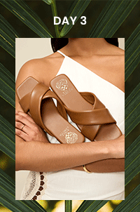 close up of brown sandal in woman's arms