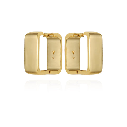 The Vince Camuto Brass Rectangle Hoop Earrings feature a chunky, gold-tone design with a smooth, polished finish. Displayed upright and facing each other against a white background, these vintage-inspired hoops add timeless elegance.