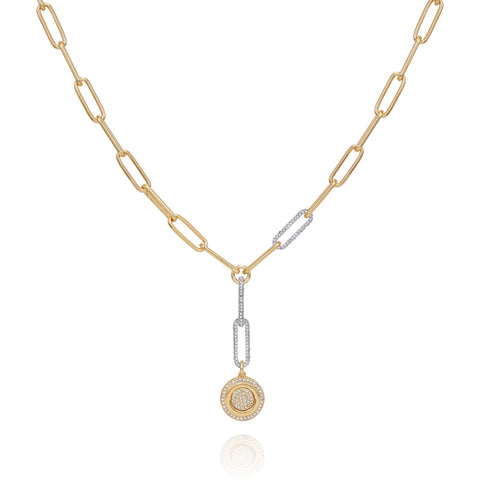 The Vince Camuto Two Tone Coin Pendant Y Necklace features elongated gold paper links, with a diamond-accented coin pendant and diamond-adorned connector links that add sparkling contrast to the primarily gold design.