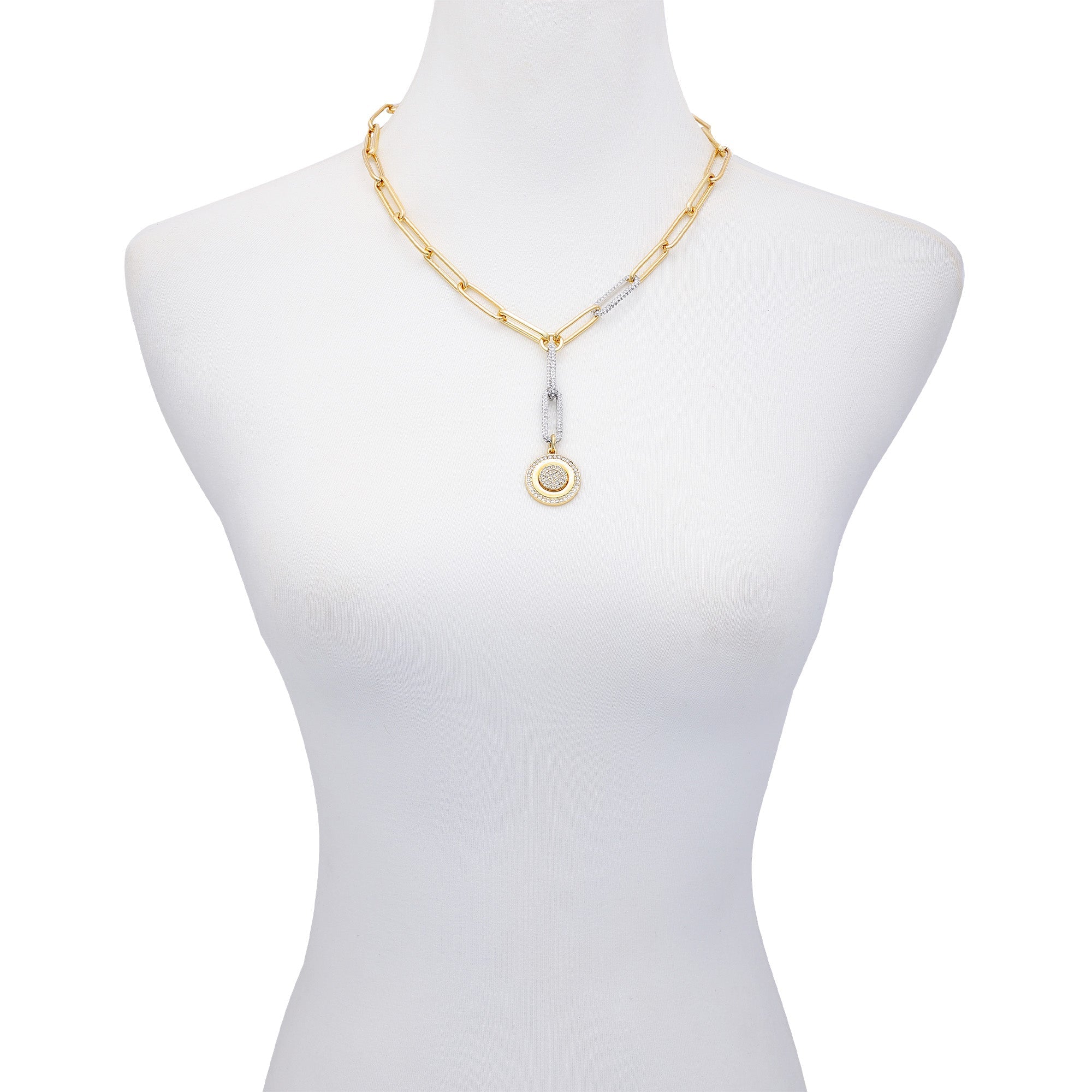 A mannequin displays the Vince Camuto Two Tone Coin Pendant Y Necklace, featuring elongated gold links and a coin-shaped pendant with silver accents for a stylish mixed-metal look.