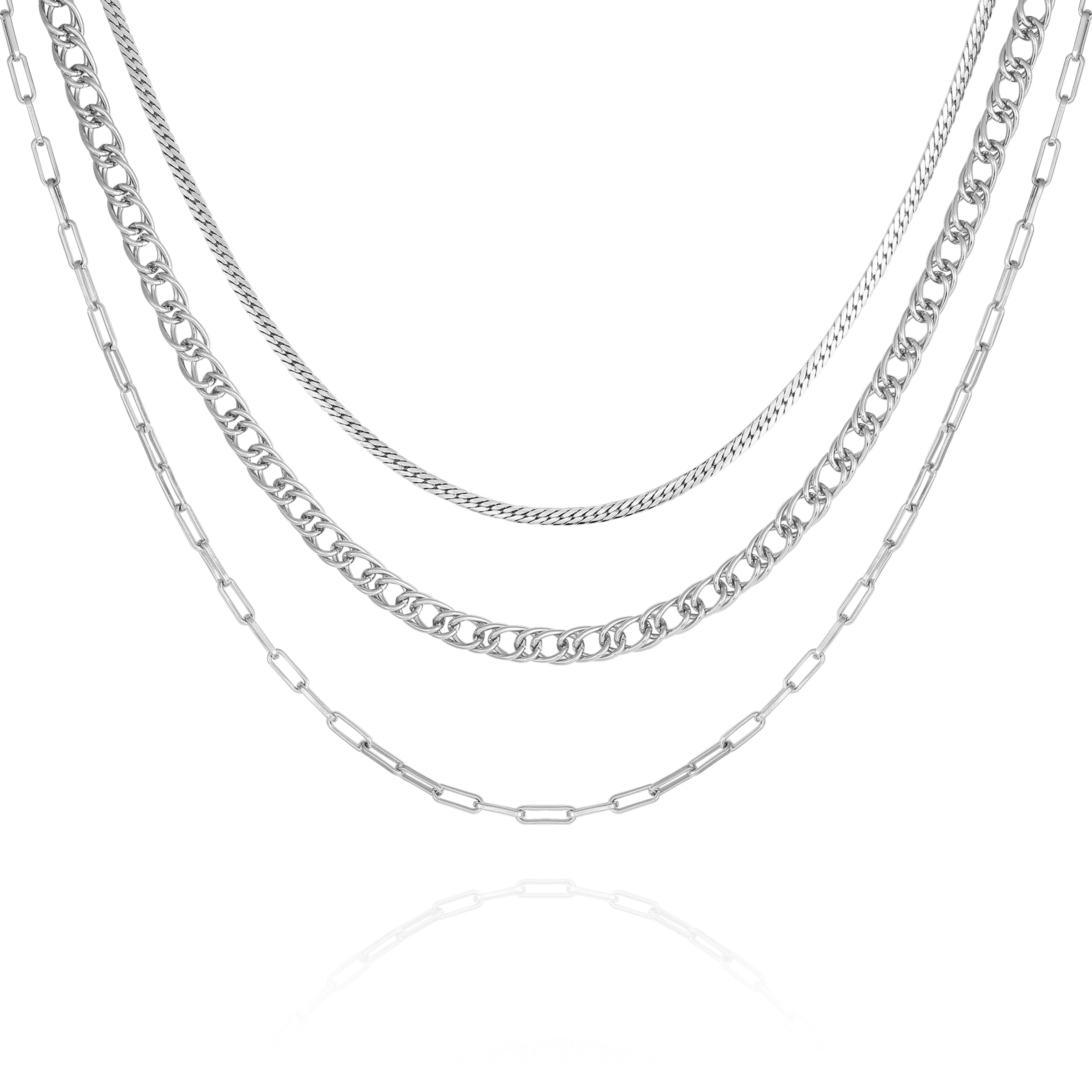 The Vince Camuto Multi Layered Chain Necklace showcases four silver chains with curb, paperclip, and classic links in varying styles and thicknesses, artfully arranged on a white background for a chic layered look.
