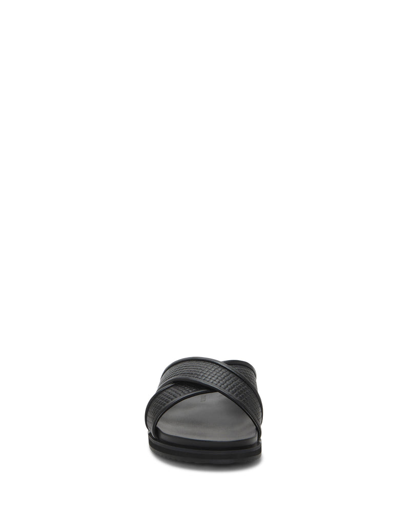 The Vince Camuto Men's Dabor Cross-Band Sandal is shown from the front, with crisscrossed textured straps and a flat sole, centered against a plain white background.