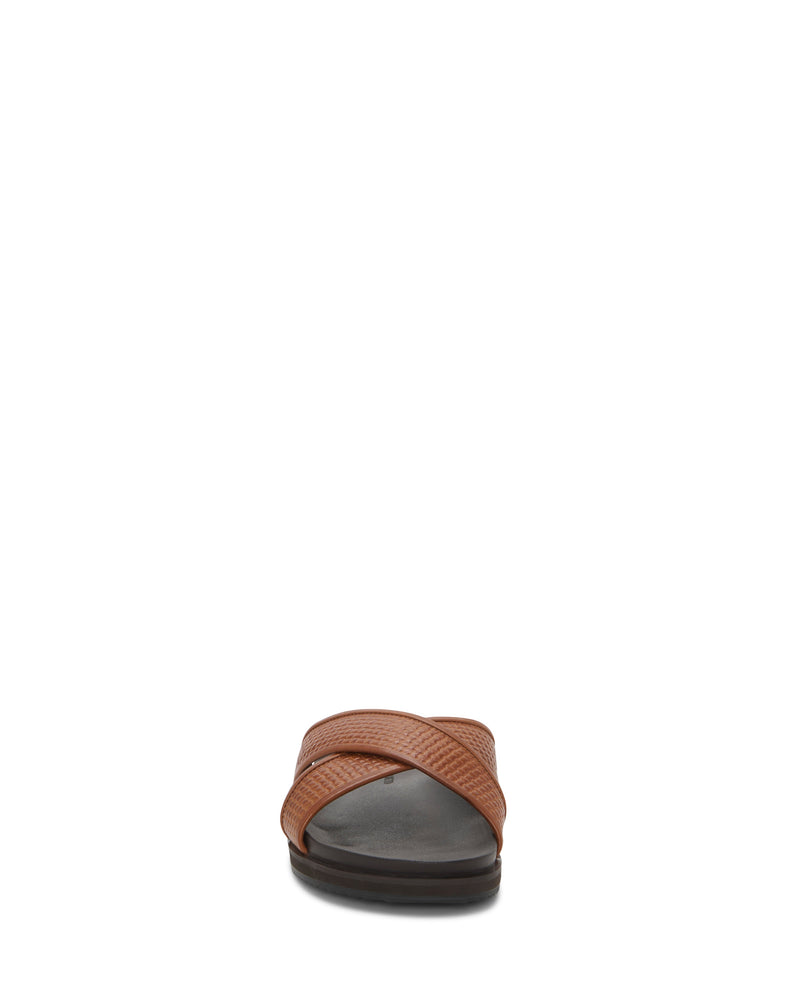 Front view of Vince Camuto Men's Dabor Cross-Band Sandal, showcasing brown crisscross leather straps, a dark sole, and plush EVA cushioning on a plain white background.