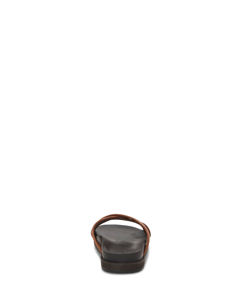 The Vince Camuto Men's Dabor Cross-Band Sandal features sleek black cross-bands and thin brown straps, viewed from the back and centered on a white background to highlight its timeless silhouette.
