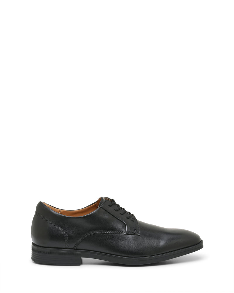The Vince Camuto Men’s Draymand Oxford is a black leather dress shoe with laces, featuring a low heel and a slightly rounded toe, shown from the side on a white background.