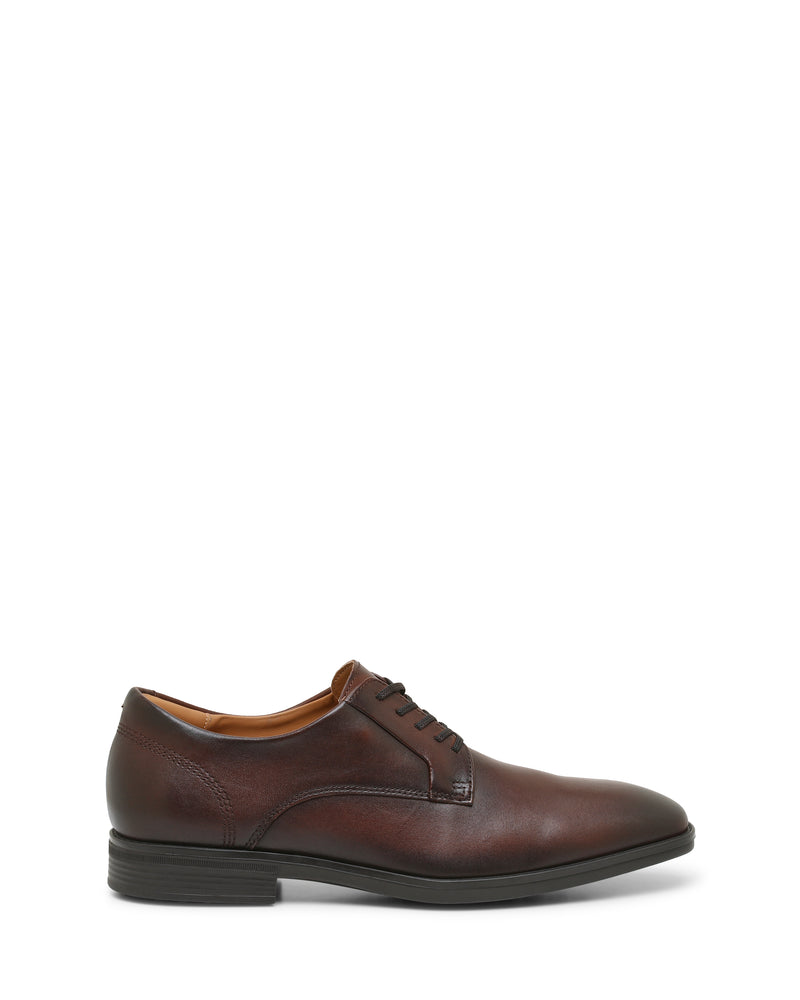 A single Vince Camuto Men’s Draymand Oxford dress shoe in brown leather with black laces and a black sole, shown in profile on a white background.
