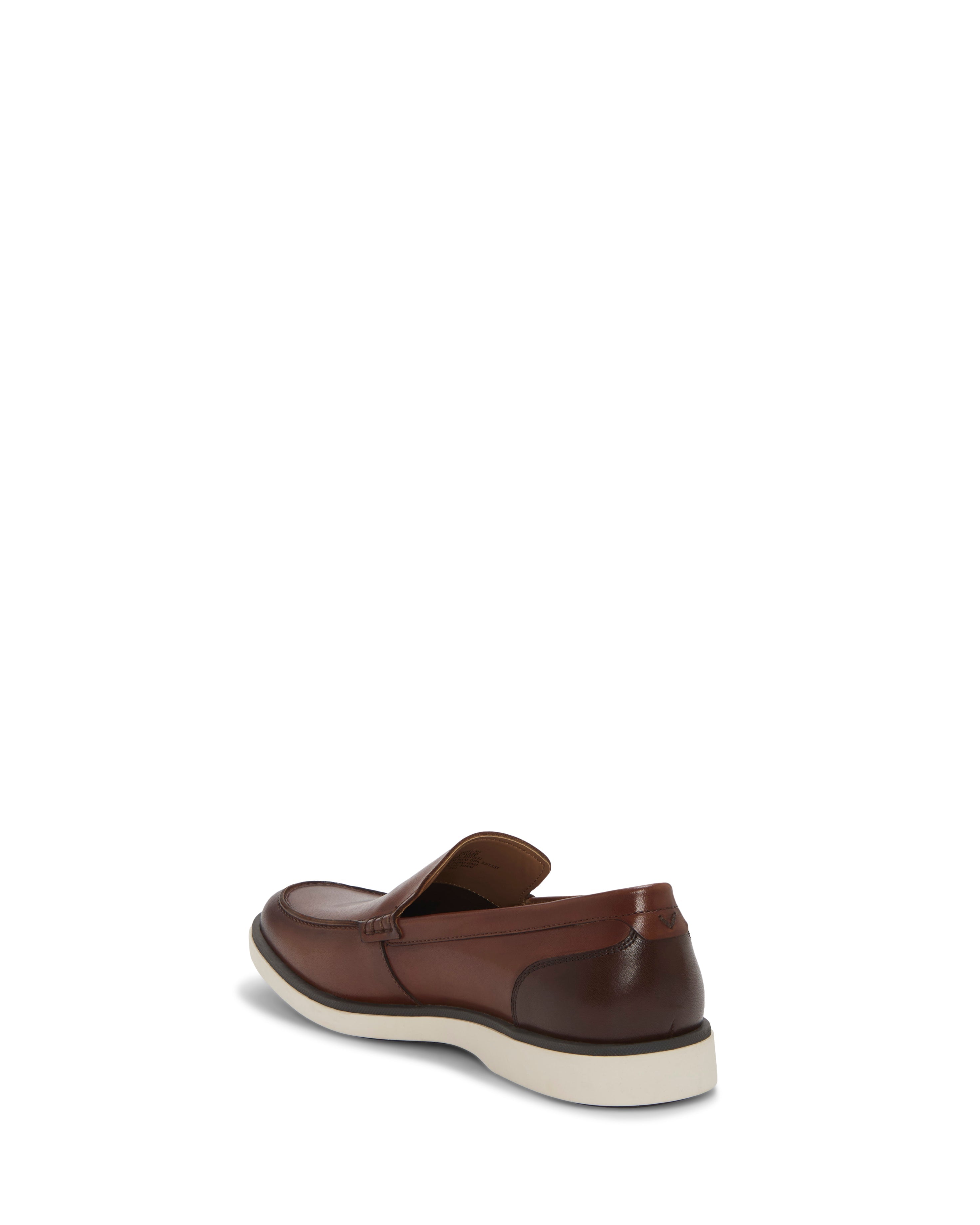 The Vince Camuto Men's Sevrin Casual Loafer, shown in brown with a white sole and EVA insole cushioning, is displayed from the back-left angle on a plain white background.