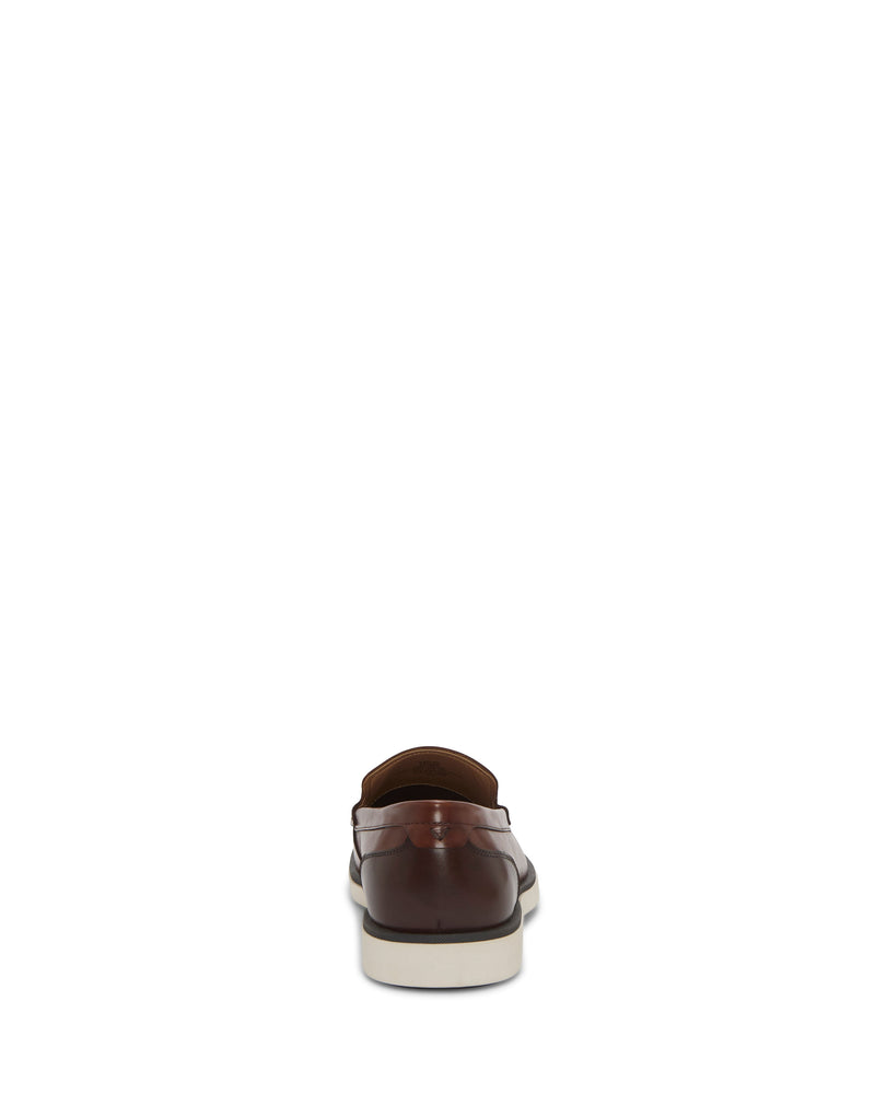 The Vince Camuto Men's Sevrin Casual Loafer, shown from the back on a plain white background, features a brown upper, white sole, and cushioned EVA insole.