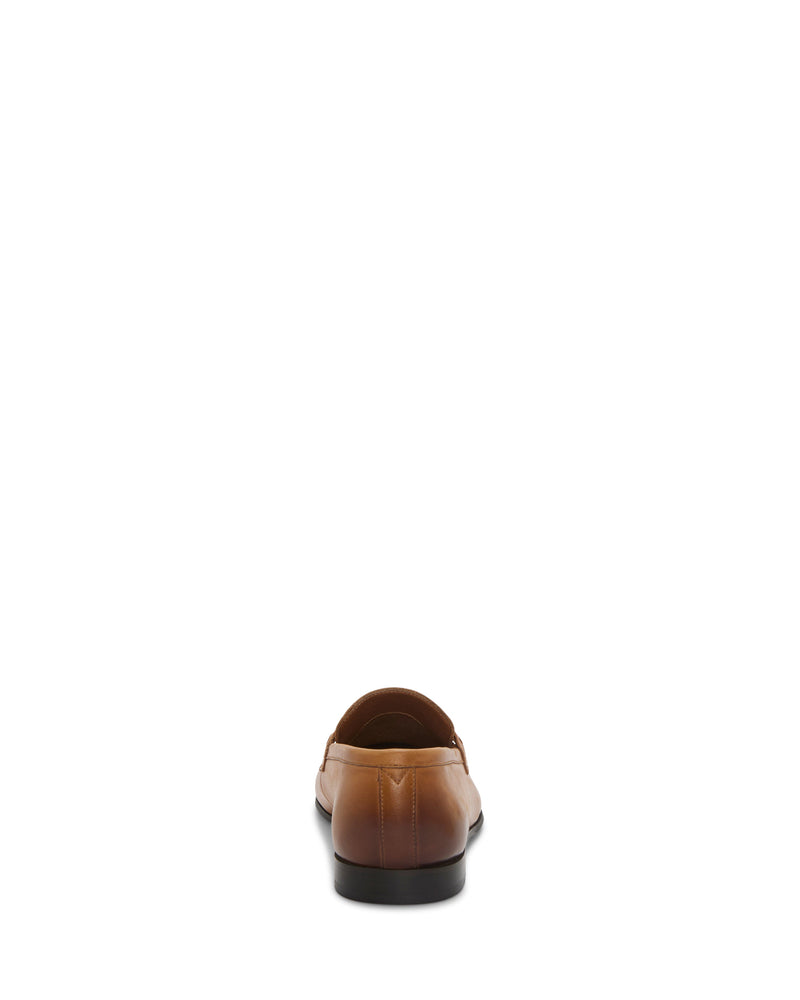 A single Vince Camuto Men's Sevvano Dress Loafer in brown leather, slip-on style, is shown from the back and centered on a plain white background.