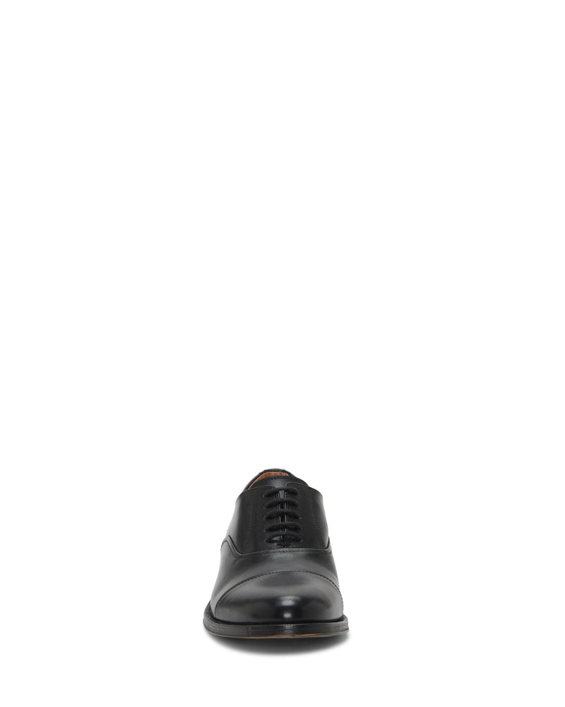 A single Vince Camuto Men's Urii black leather cap toe oxford dress shoe, shown from the front against a plain white background.