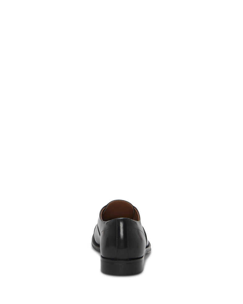 Back view of the Vince Camuto Men's Urii Dress Oxford in black leather on a white background. Features a low heel, polished finish, and classic cap toe, with the heel and sole clearly visible.