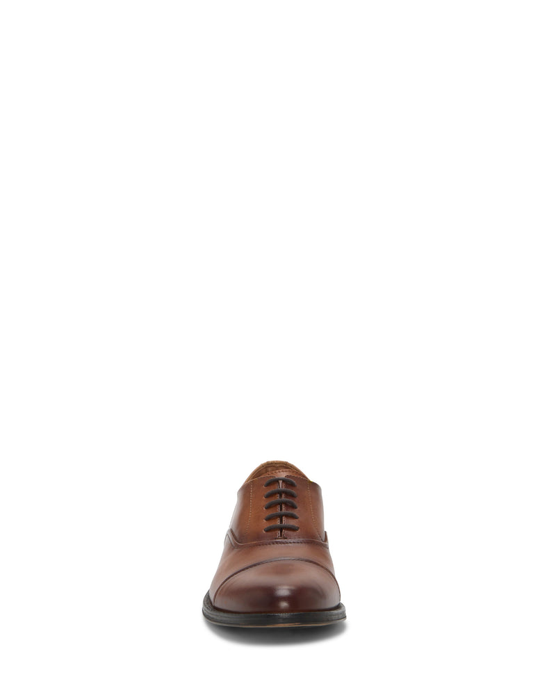 The Vince Camuto Men's Urii Dress Oxford, a brown leather cap toe shoe, is shown from the front and centered against a plain white background.