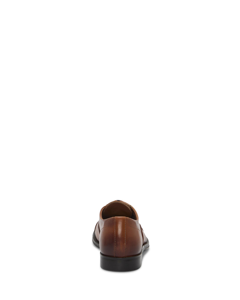 A single Vince Camuto Men's Urii Dress Oxford in brown leather is centered on a white background, shown from the back with the heel and sole clearly visible.