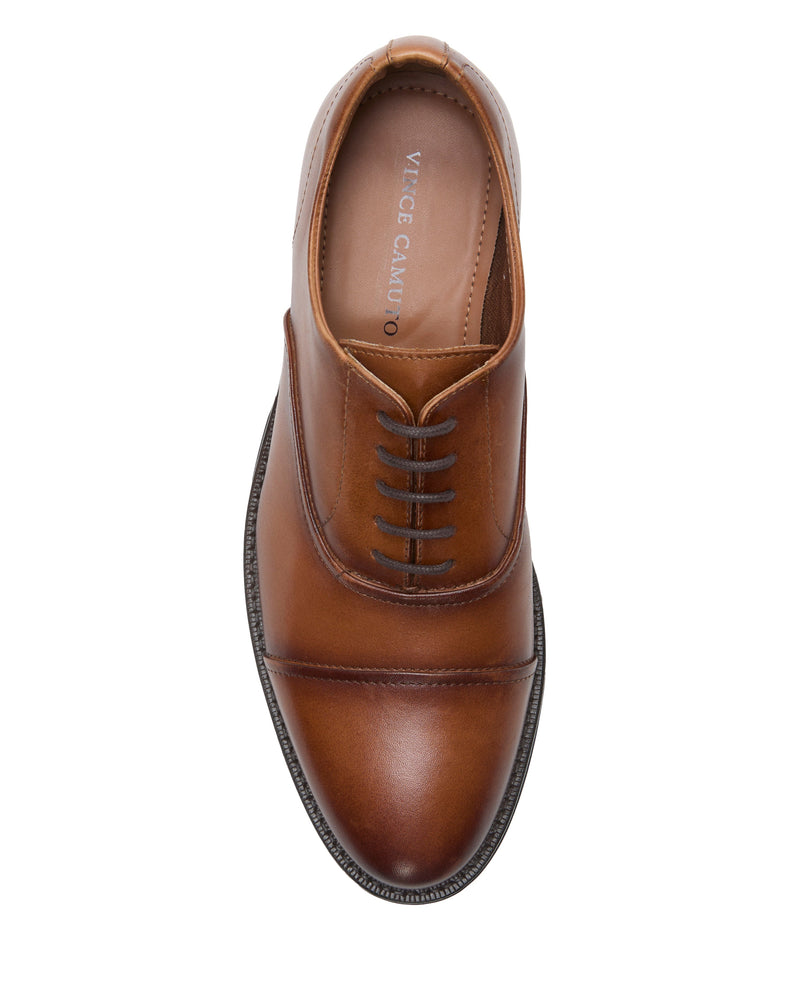 Top view of the Vince Camuto Men's Urii Dress Oxford—brown leather with dark brown laces, rounded toe, subtle stitching, and a smooth finish for classic formal style.