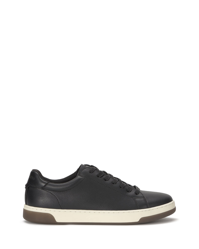 The Vince Camuto Men's Wynsten Sneaker is a black low-top with white sole and black laces, shown in side profile on a white background. It features an EVA insole for comfort, making it ideal as an everyday casual sneaker.