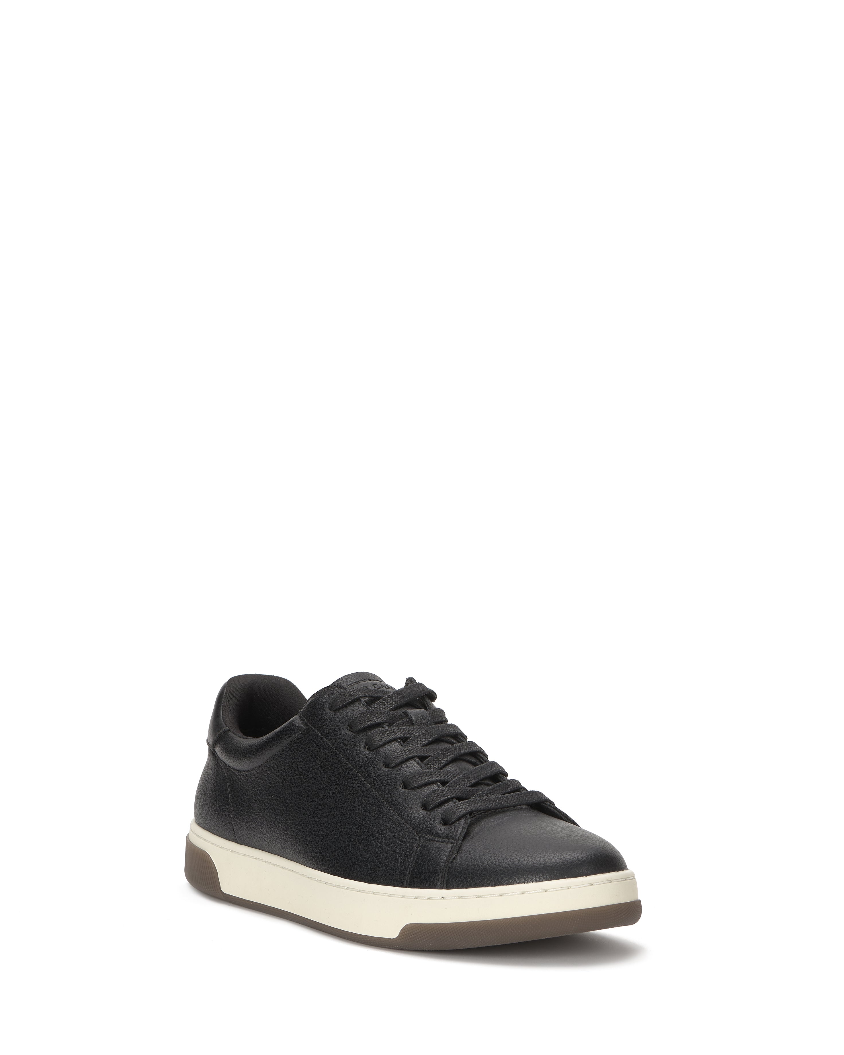 The Vince Camuto Men's Wynsten Sneaker in black, featuring black laces, a white midsole, brown outsole, and EVA insole, is shown at a slight left-facing angle against a white background.