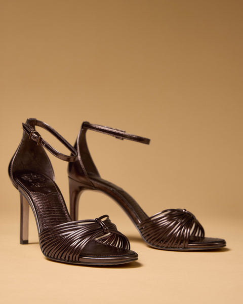 Vince Camuto Blaine metallic bronze tall heel sandals featuring thin, multi-strap knotted vamps and buckled ankle straps.