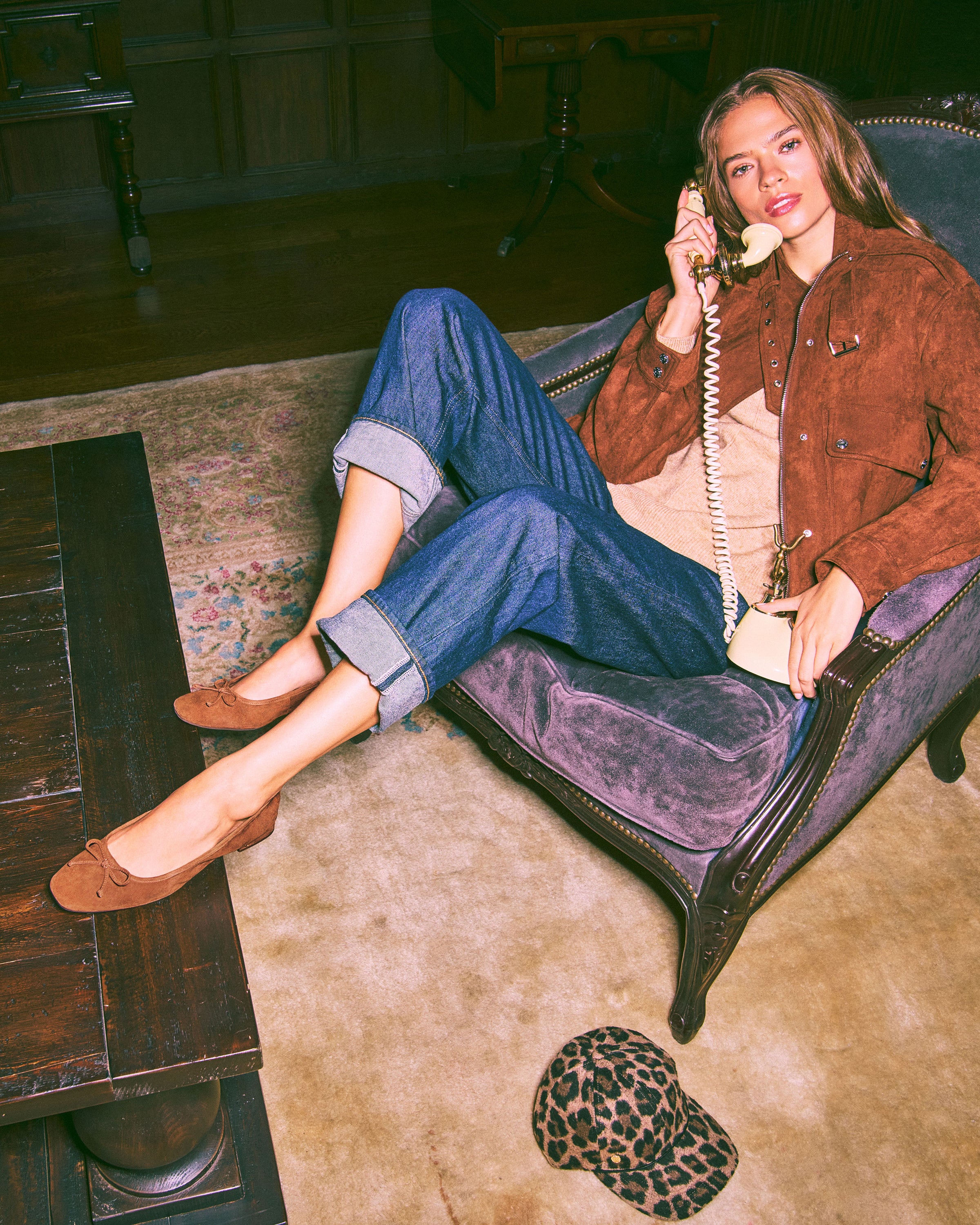 woman sitting in chair wearing jenlea ballet flat